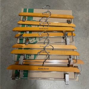 Vintage Original bebe wood hangers with clips Set of 8